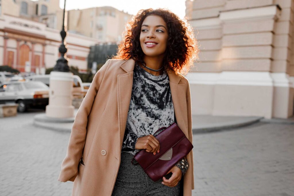 Stylish black woman walking in Paris' streets
