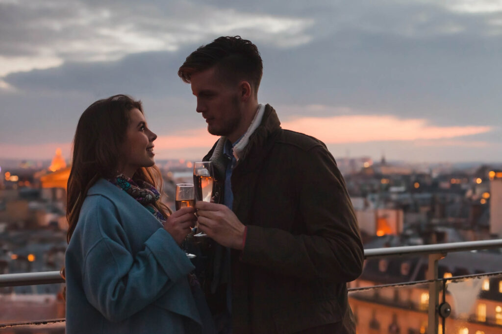 Young couple flirting on rooftop in Paris