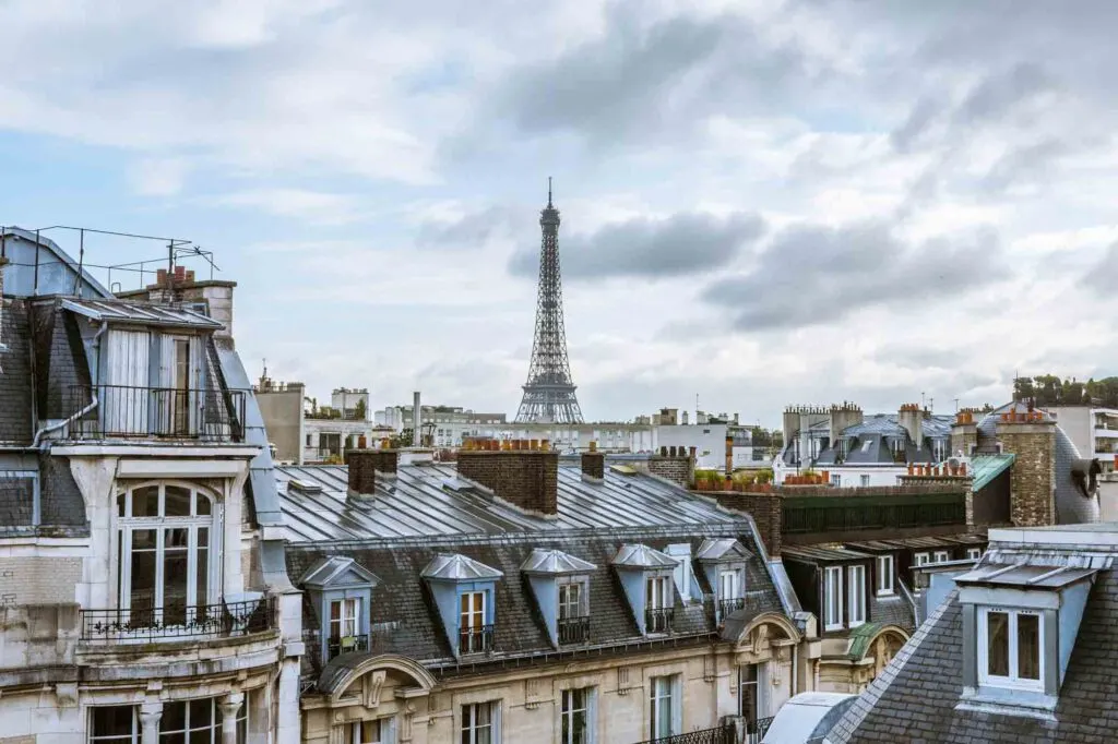 View of Eiffel tower from a roof in Paris on a gray cloudy winter day