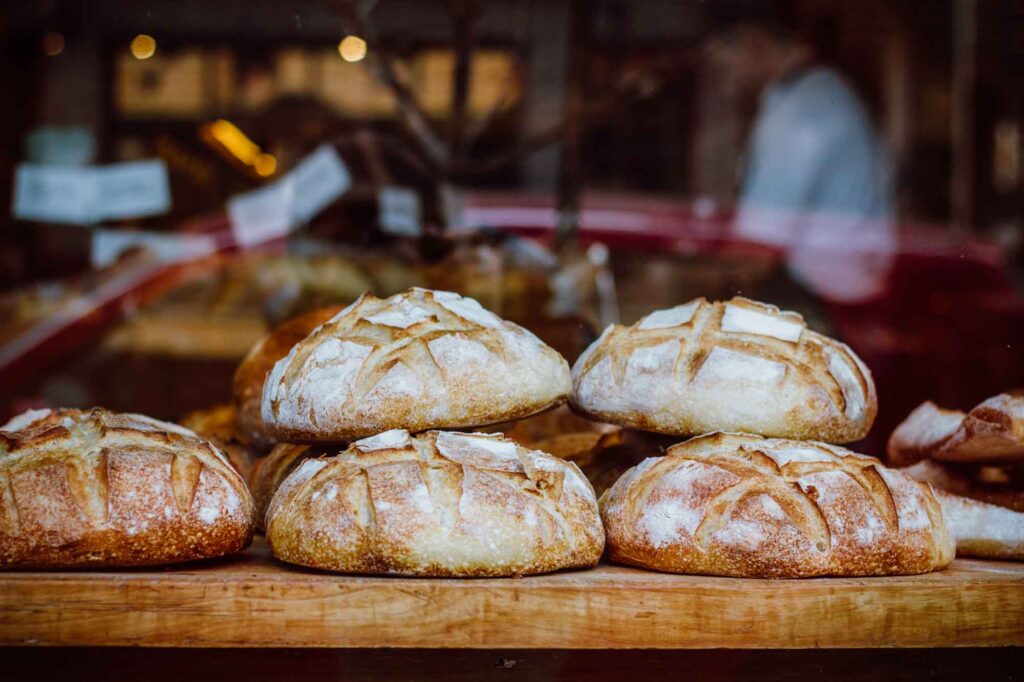 Window of bakery with fresh breads in Paris