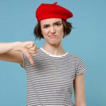 Young unhappy woman wearing traditional French outfit