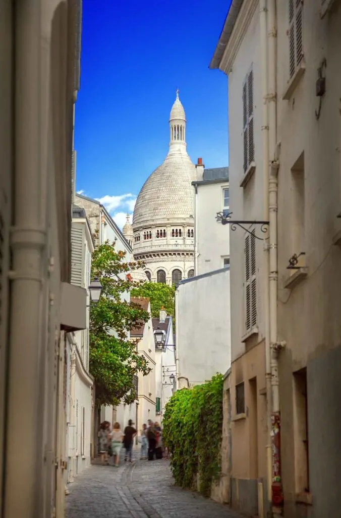 View of Sacre Coeur from Rue Saint Rustique in Montmartre