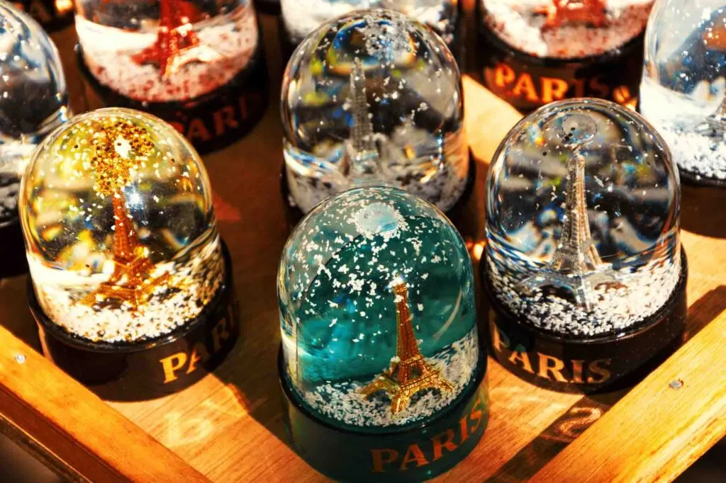 Snow globes with Eiffel Tower is a Christmas souvenir