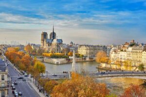 Scenic view of Notre-Dame de Paris with Saint-Louis and Cite islands on a bright fall day