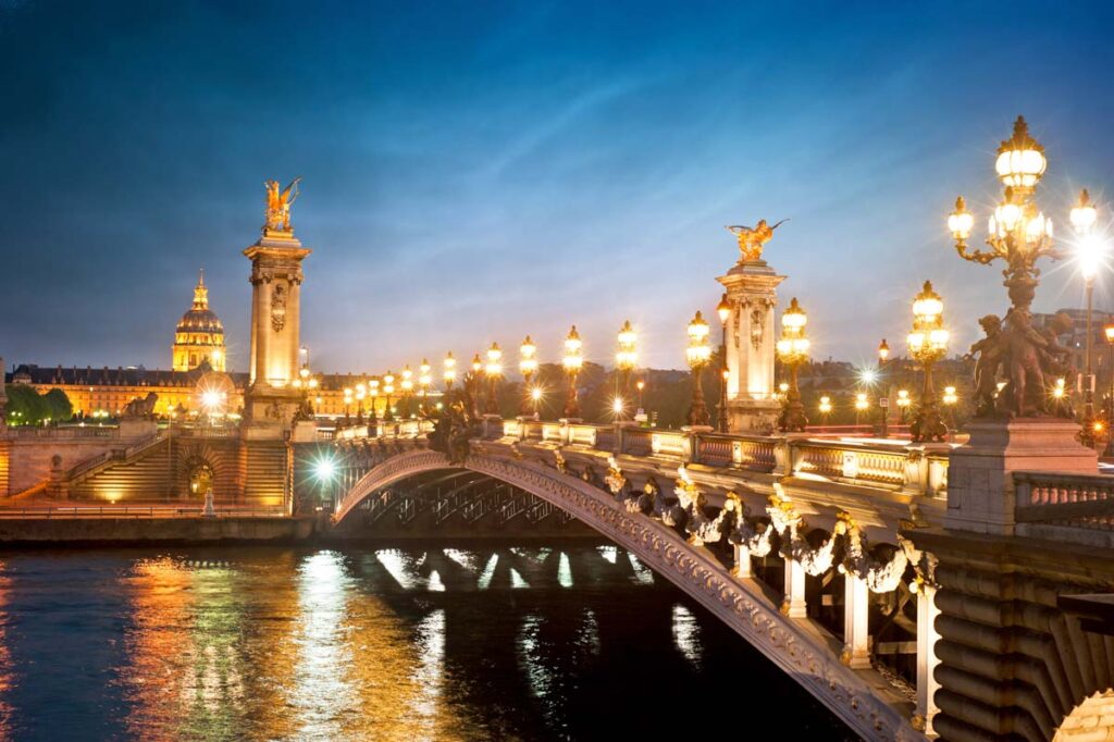 Beautiful lights illuminate the streets of Paris at night