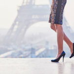 Woman wearing high heels of French shoe brand near the Eiffel tower in Paris