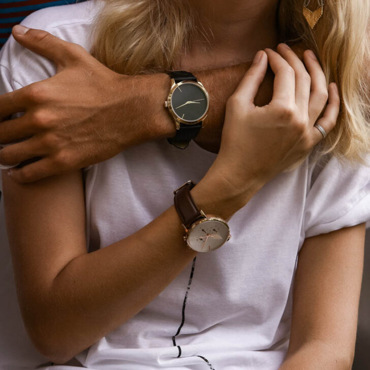 Close-up of couple hands wearing French watches