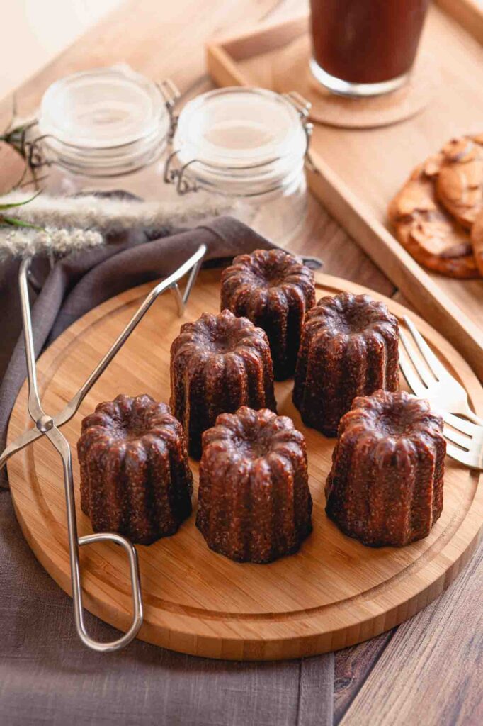 Coffee and canelé are on the table.